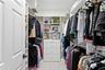 Owner's en suite features TWO Wardrobe sanctuaries, custom designed for tailored organization