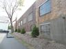 View of side of home featuring brick siding