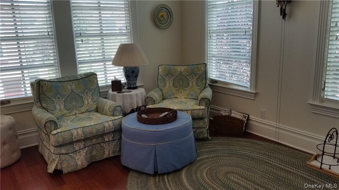 Open concept den right off the kitchen... relax with a drink, watch TV, or just listen to what's going...