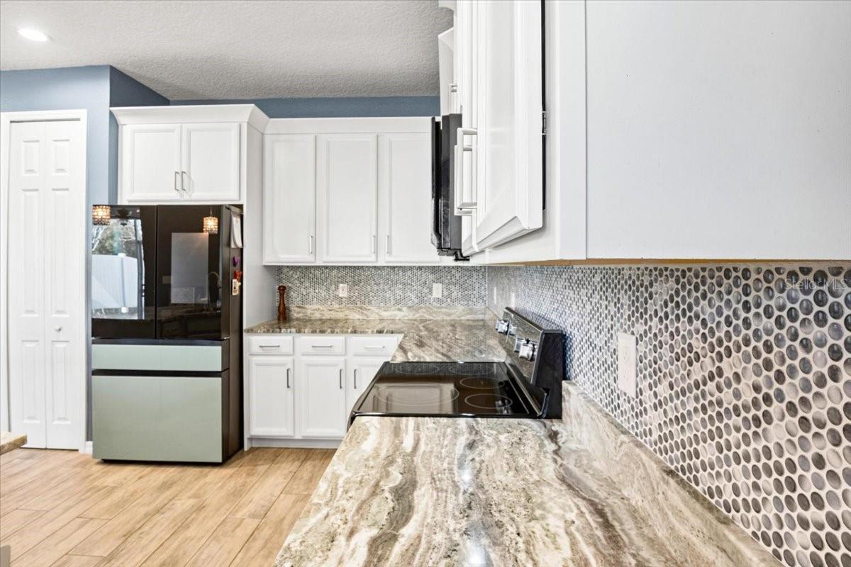 Kitchen with painted maple cabinets
