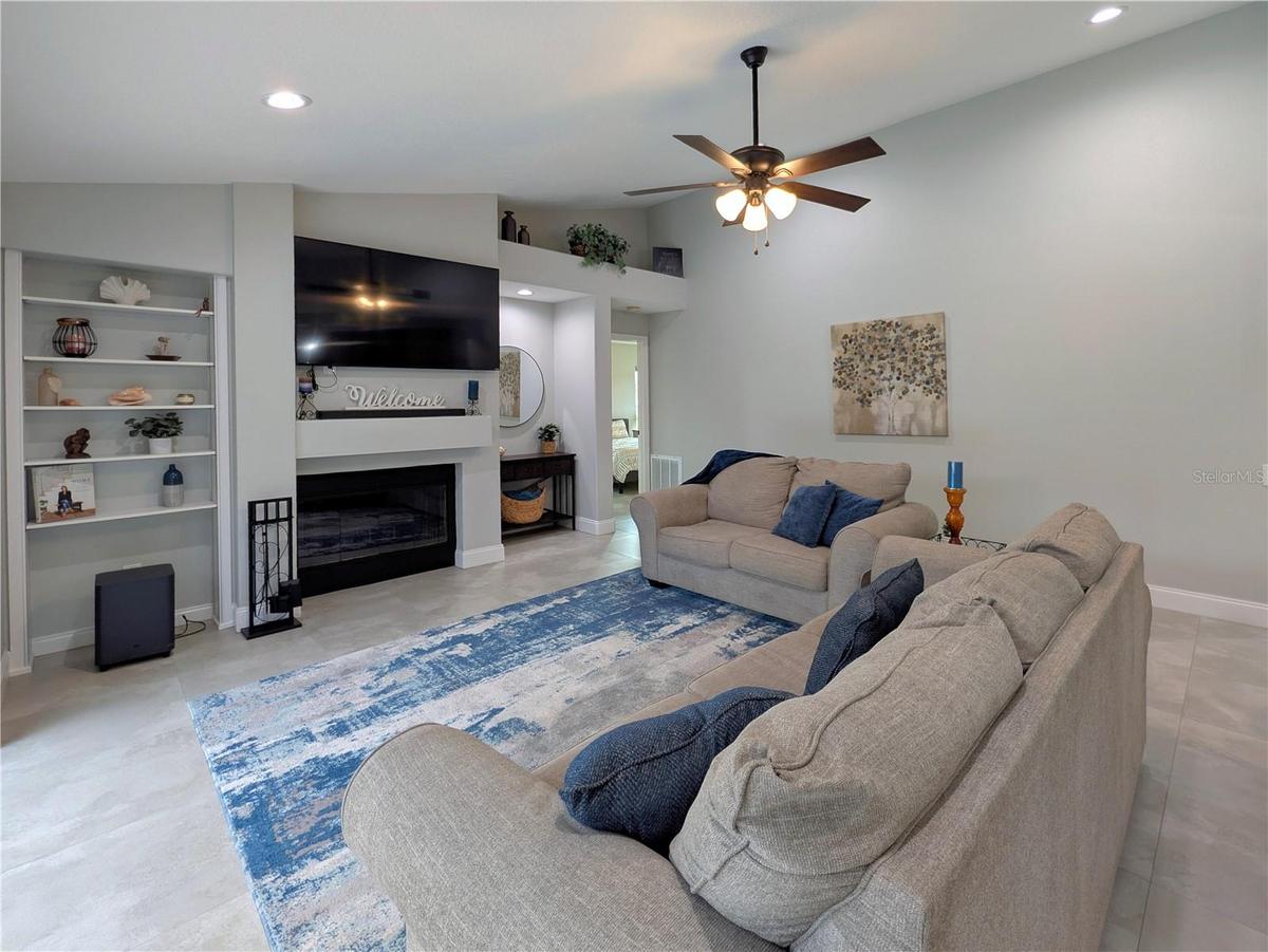 Living room with wood burning fireplace