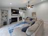 Living room with wood burning fireplace