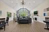 Spacious Clubhouse Great Room with vaulted ceiling and fireplace