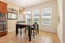 Dining area with a door that leads to the pool bath.