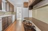 Eat-in-Kitchen with Dishwasher, Stove and double door Refrigerator.  Window over the kitchen sink. Laminate flooring
