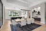 It is designed to create a dramatic backdrop for intimate dinners and larger gatherings alike.
