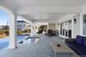 View of patio / terrace featuring outdoor lounge area and a pool with connected hot tub
