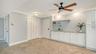 The cabinetry and granite extend into the entire length of the dining area, creating additional storage and an elegant serving space.