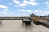 View of patio with a skyline view and outdoor dining space