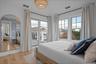 Bedroom featuring light wood finished floors and access to exterior
