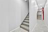 Stairs with elevator, tile patterned floors, and recessed lighting