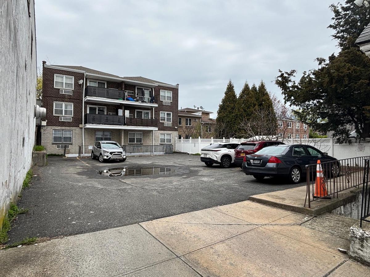 Uncovered parking lot with fence
