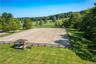 Adjacent to the indoor, a 220' x 100' outdoor jumping ring and a 200' x 80' outdoor dressage ring. View of the dressage ring.