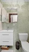 Bathroom with tile walls and vanity