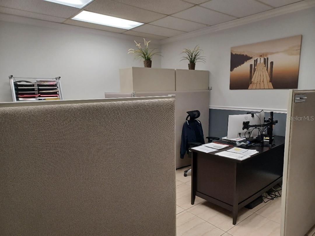 Large open room with cubicles