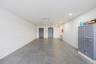 Empty room featuring cooling unit and recessed lighting