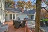 Wooden terrace with outdoor dining space, french doors, a patio, and area for grilling