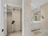 Custom closet adjacent to master suite