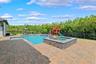 The backyard is the focal point of this property.  Oversized patio with a heated salt pool and built-in spa.