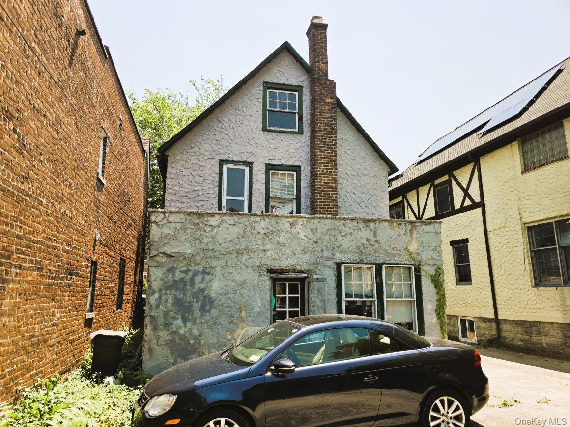 Rear of structure with door access to patio.