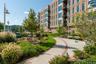 A beautifully landscaped on-mile Esplanade winds along the waterfront, framed by mature trees, lush shrubbery, and breathtaking water views.