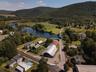 Aerial overview of property's location featuring a water and mountain view