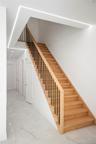 Stairs with baseboards and recessed lighting