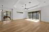 The family room is highlighted by an impressive 9-by-12-foot window framing protected conservation views.