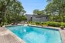 View of swimming pool with a wooden deck