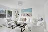 Living room with wood finished floors and baseboards
