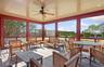 Sunroom with a ceiling fan, an outdoor hangout area, and a healthy amount of sunlight