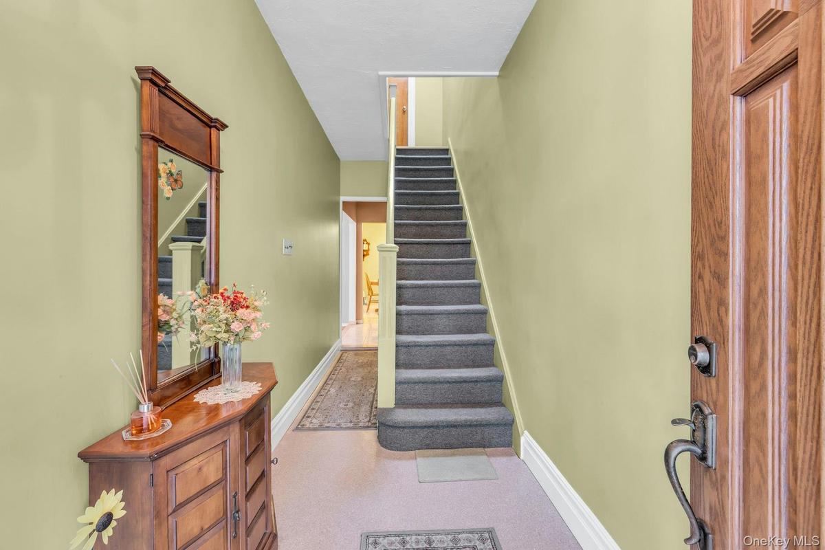 Front door with stairs to second floor apartment.