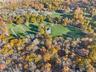 Aerial overview of property's location featuring a forest