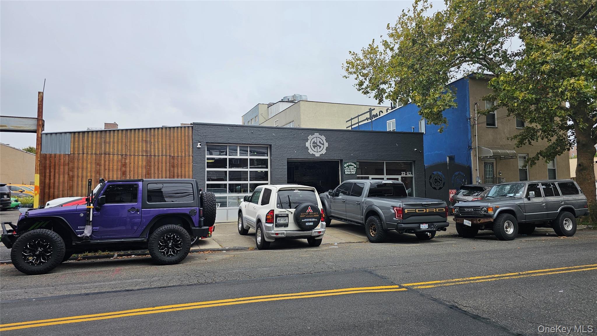 View of property with uncovered parking