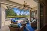 Large screeded lanai and pool overlooking the golf course