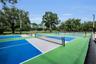 New fenced in pickleball courts at Commons Park