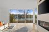 Living room featuring expansive windows and light wood-type flooring