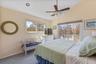 2nd floor primary en suite with balcony overlooking rear yard