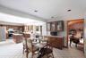 Dining area with light tile patterned floors and recessed lighting