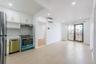 Kitchen featuring white cabinetry, appliances with stainless steel finishes, recessed lighting, a wall mounted AC, and under cabinet range hood
