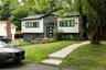 Contemporary facade with horizontal siding and stacked stone accents