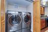 Samsung front loading washer and dryer in interior Laundry Closet.