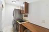 Laundry room complete with sink, work space for folding and washer and dryer.