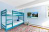 Bedroom with a baseboard radiator and wood-type flooring