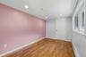 Office with hardwood  flooring with a matte finish, recessed lighting, and a white-trimmed window