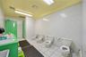Full bathroom with a bidet, tile patterned floors, tile walls, vanity, and a shower