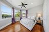 This is the second bedroom upstairs with panoramic lake views and access to the balcony.