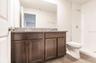 Primary ensuite bath with dual sinks in the single vanity, plus a walk-in shower