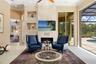 Modern gas fireplace and custom designed travertine wall