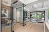 Custom lighting, designer finishes, elegant drapery, plantation shutters and high-end built-in features, show that every detail of this home has been 